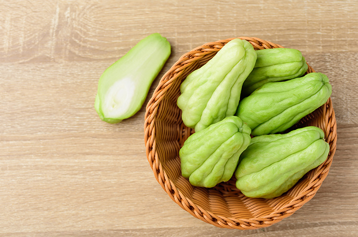 Chayote squash or Mirlition squash in basket on wooden background,