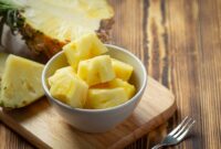 fresh pineapple on dark wooden backgroud